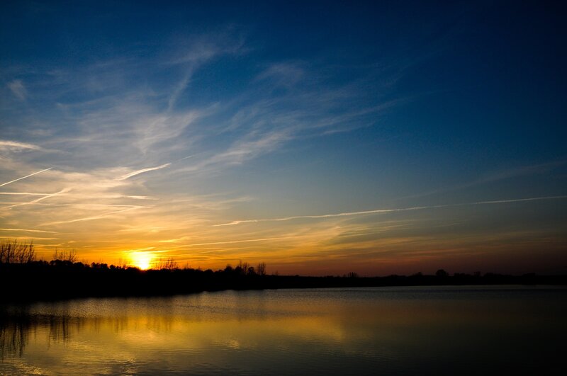 Sunset over Lake — Blue, Serene, Photograph, Sky, Trees, Clouds, Yellow