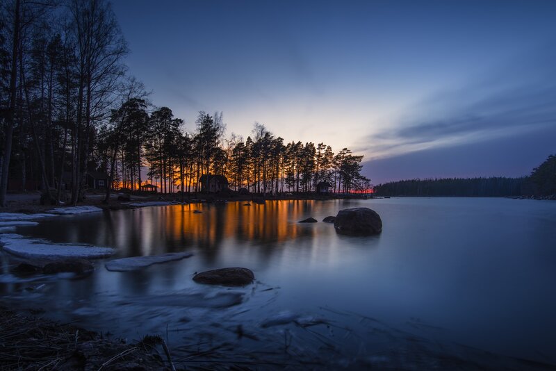 Sunset over Lake — Blue, Serene, Photograph, Trees, Rocks, Snow