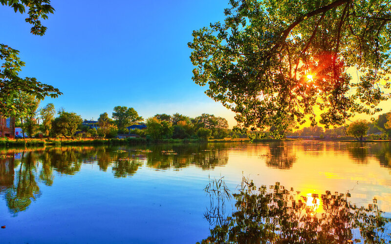 Sunset over Lake — Blue, Serene, Photograph, Trees, Sky, Reflection, Sun