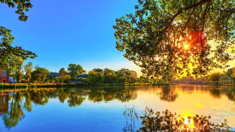 Sunset over Lake — Blue, Serene, Photograph, Trees, Sun, Reflection