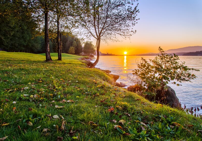 Sunset over Lake — Green, Serene, Photograph, Trees, Grass, Mountains
