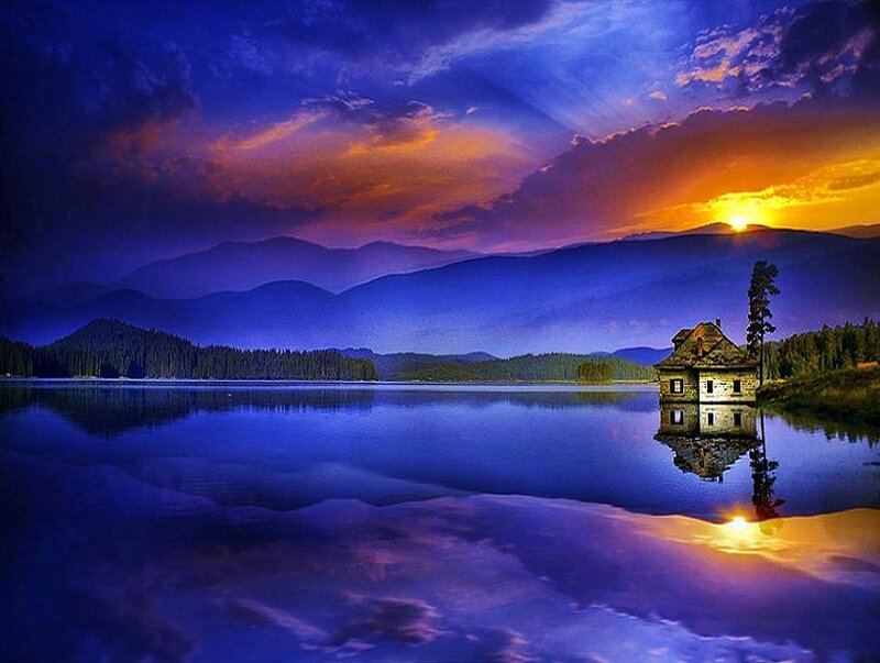 Sunset over lake house