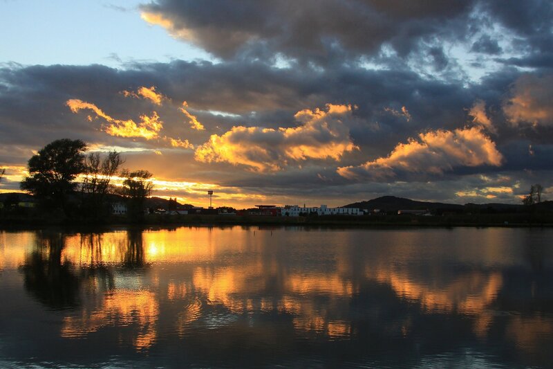 Sunset over Lake — Orange, Dramatic, Photograph, Clouds, Buildings