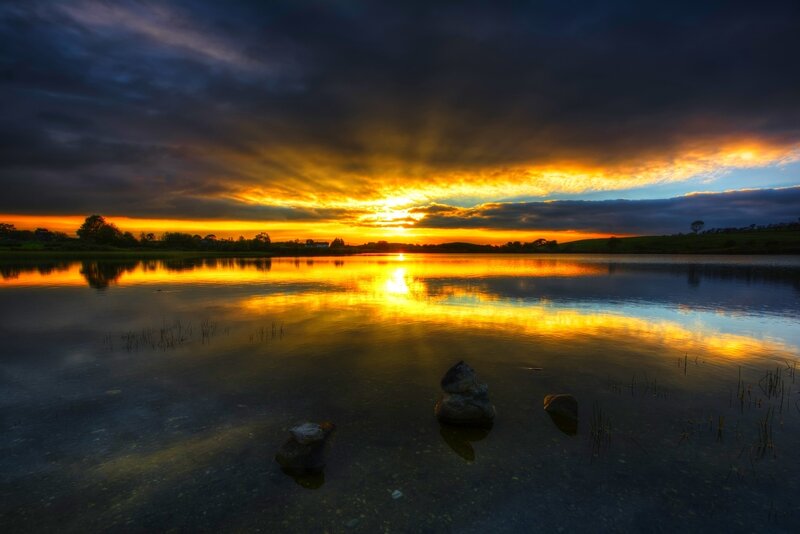 Sunset over Lake — Orange, Dramatic, Photograph, Clouds, Rocks, Trees