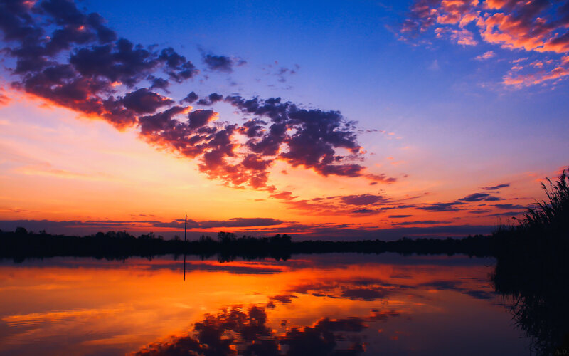 Sunset over Lake — Orange, Dramatic, Photograph, Clouds, Trees, Pole