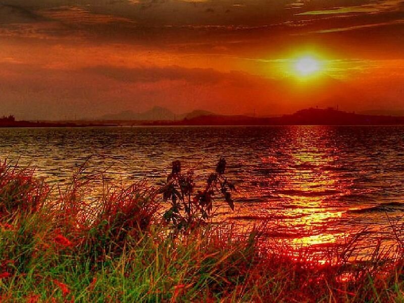 Sunset over Lake — Orange, Dramatic, Photograph, Grass, Mountains, Sun