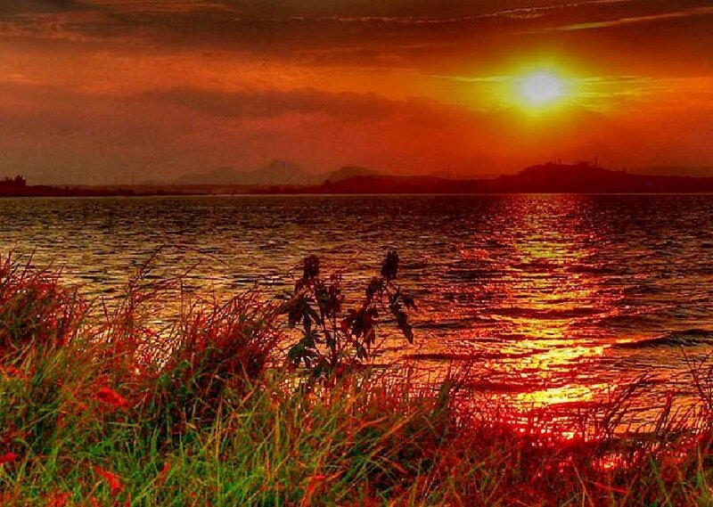 Sunset over Lake — Orange, Dramatic, Photograph, Grass, Mountains
