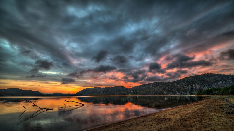 Sunset over Lake — Orange, Dramatic, Photograph, Mountains, Clouds, Driftwood, Gray
