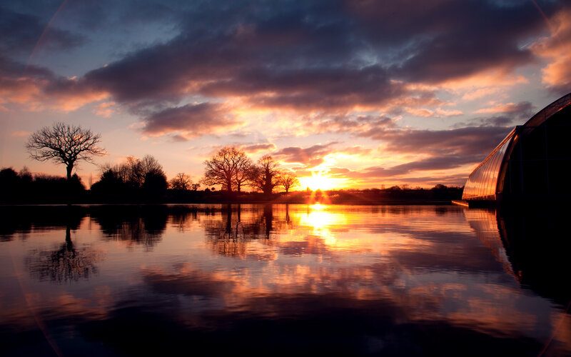 Sunset over Lake — Orange, Dramatic, Photograph, Trees, Clouds, Building