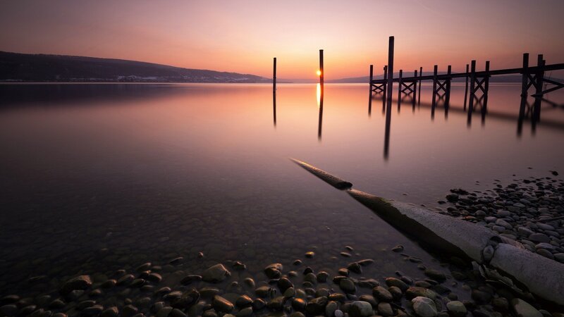 Sunset over Lake — Orange, Serene, Photograph, Dock, Pebbles, Sun