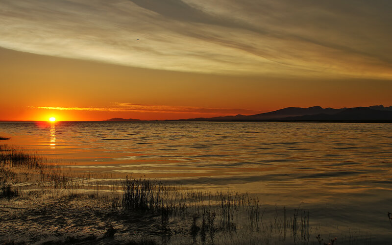 Sunset over Lake — Orange, Serene, Photograph, Mountains, Sky, Water, Reeds