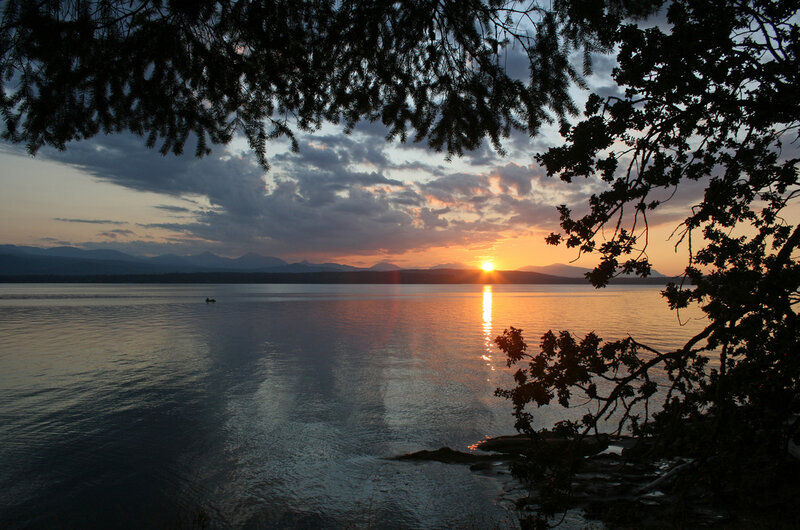 Sunset over Lake — Orange, Serene, Photograph, Mountains, Tree Branches
