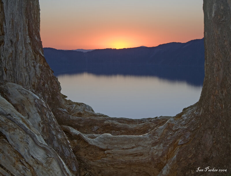 Sunset over Lake — Orange, Serene, Photograph, Mountains, Tree Roots