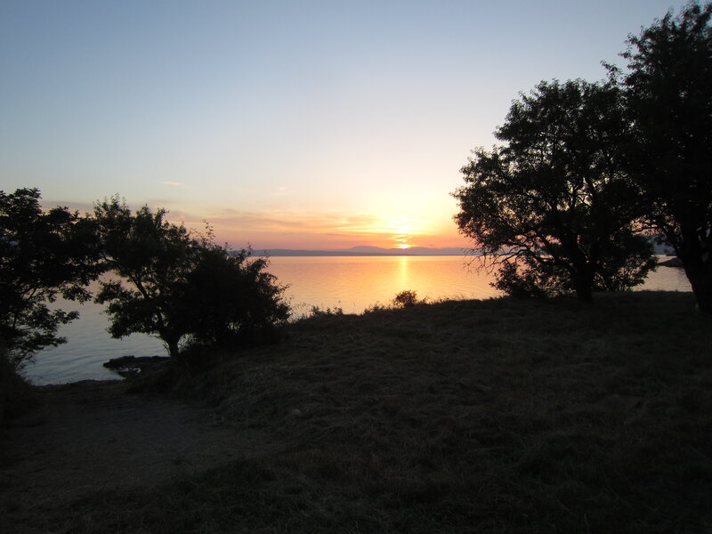 Sunset over Lake — Orange, Serene, Photograph, Trees, Grass, Water