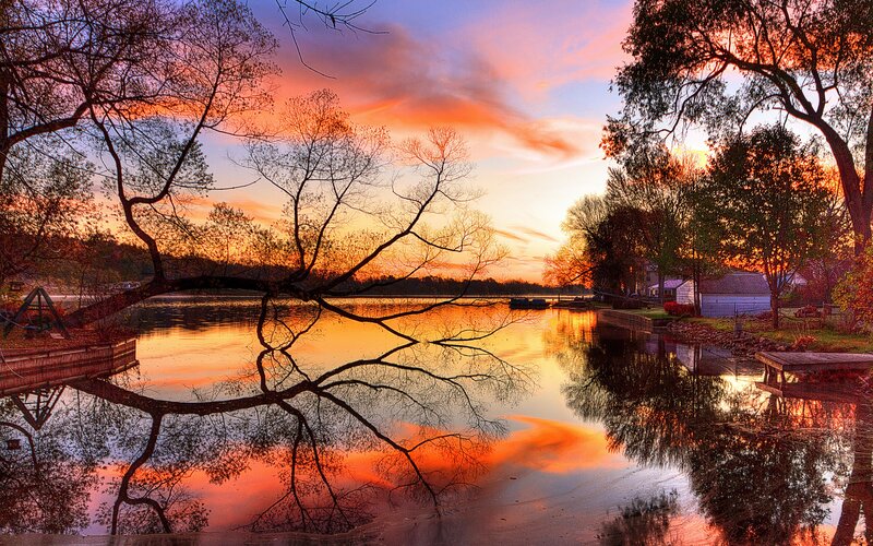 Sunset over Lake — Orange, Serene, Photograph, Trees, House, Dock, Reflection
