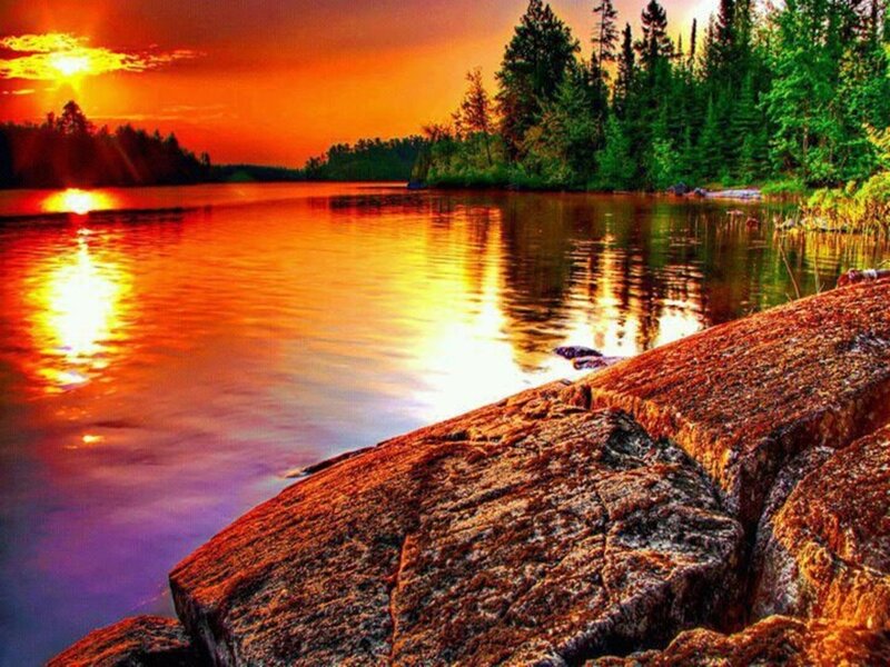 Sunset over Lake — Orange, Serene, Photograph, Trees, Rocks, Sun