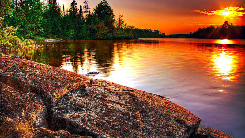 Sunset over Lake — Orange, Serene, Photograph, Trees, Rocks
