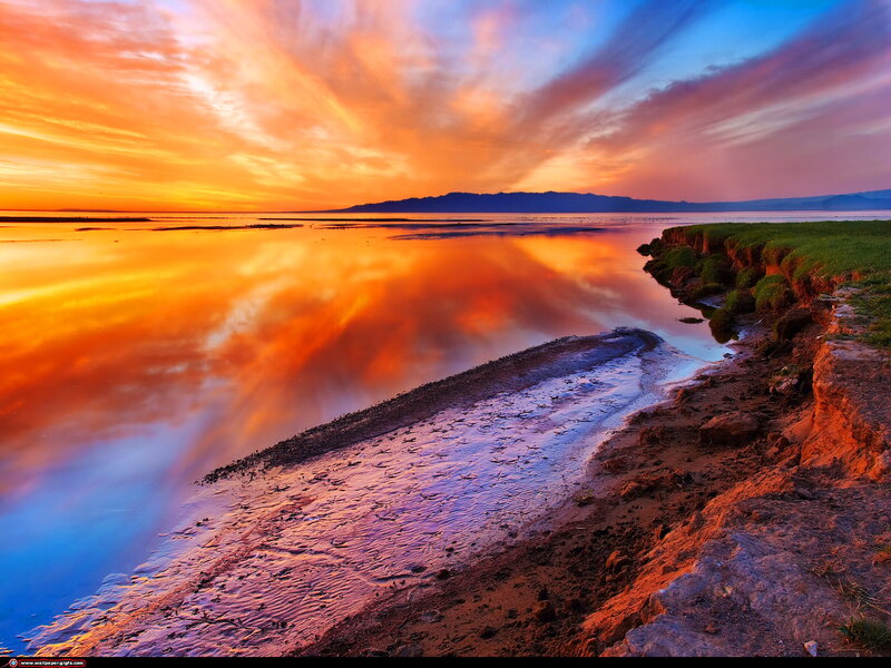 Sunset over Lake Shore — Orange, Dramatic, Photograph, Mountains, Clouds