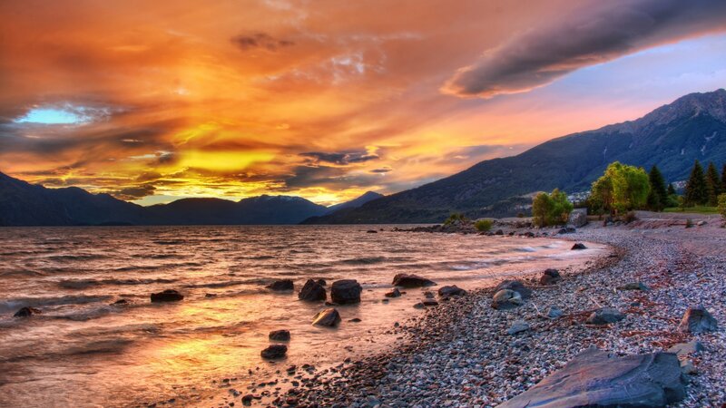 Sunset over Lake Shore — Orange, Dramatic, Photograph, Mountains, Rocks