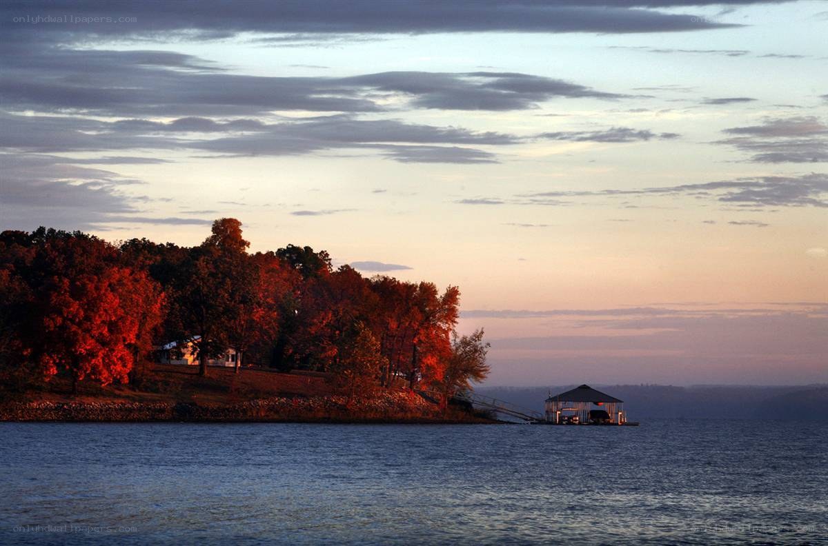 sunset over lake with autumn trees