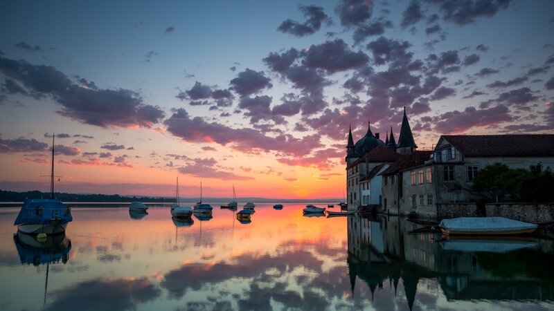 Sunset over Lake with Boats — Orange