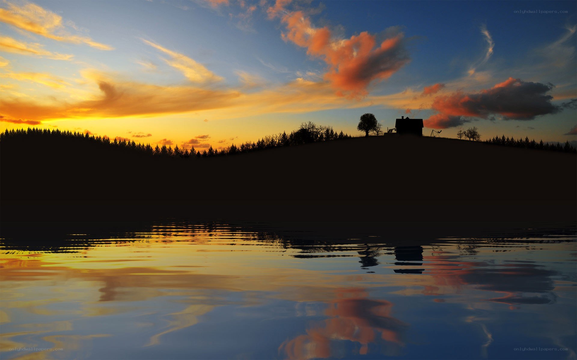 sunset over lake with cabin