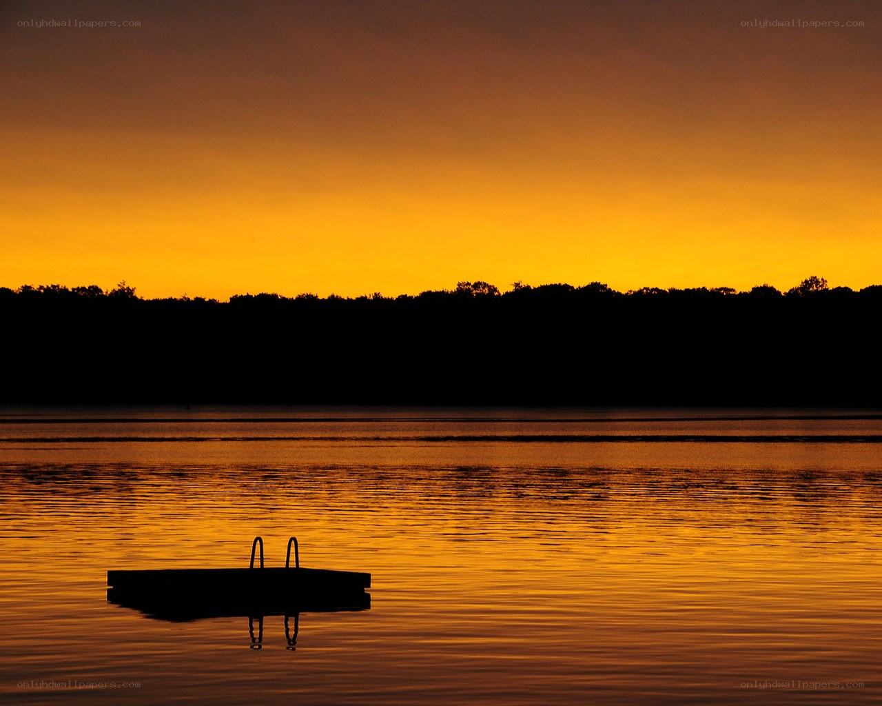 sunset over lake with dock