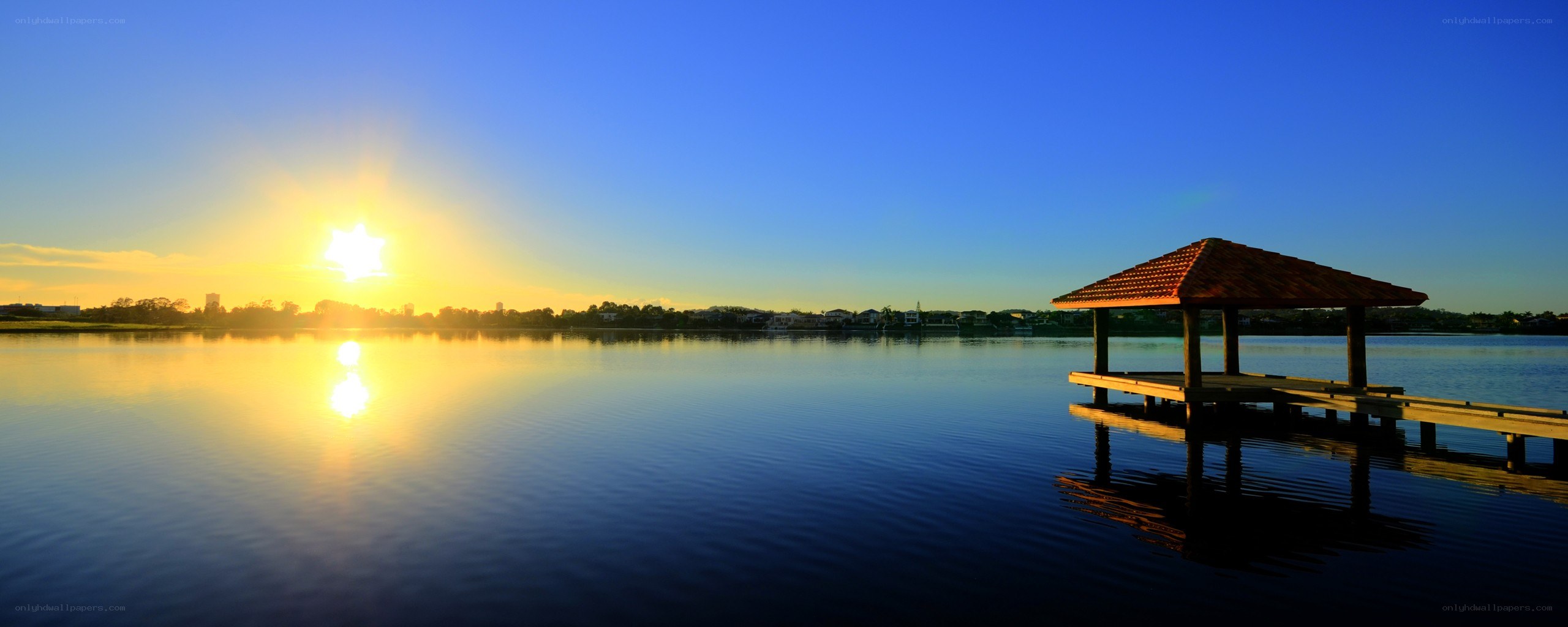 Sunset over lake with gazebo
