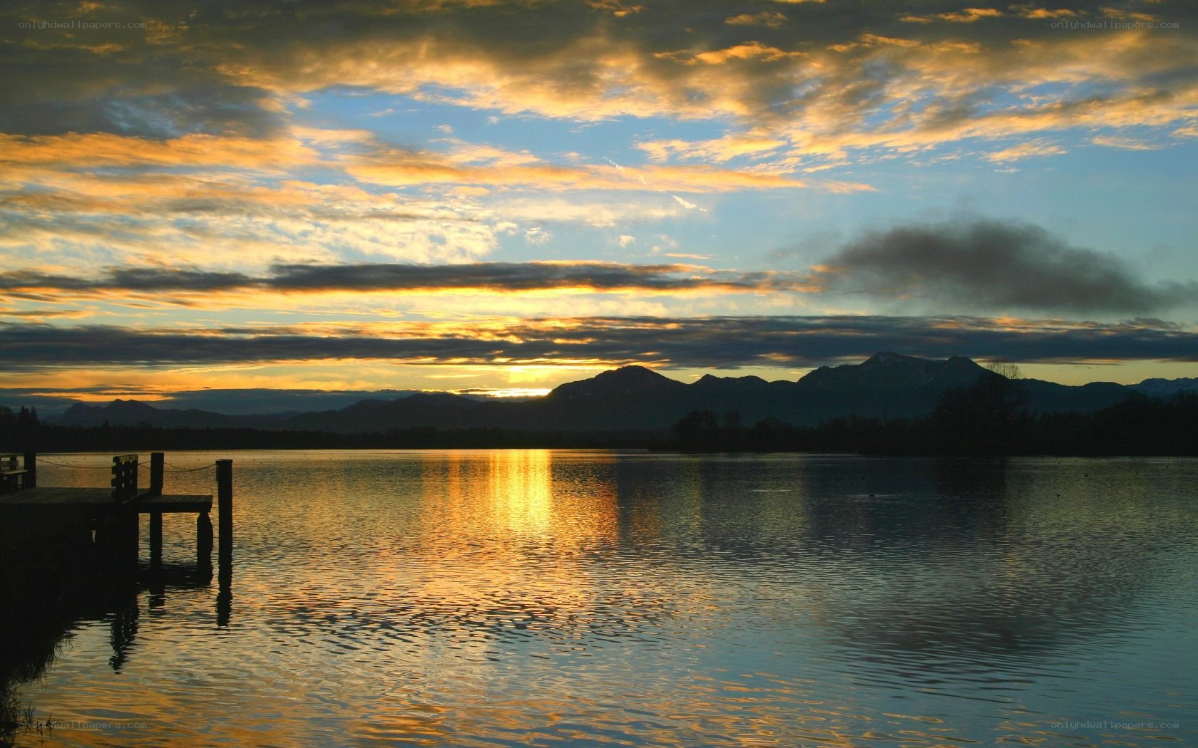 Sunset over lake with mountains