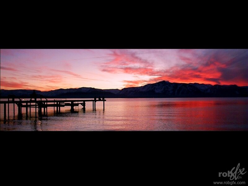 sunset over lake with pier