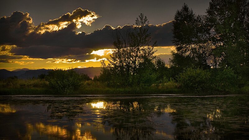 Sunset over Lake — Yellow, Dramatic, Photograph, Clouds, Trees, Mountains