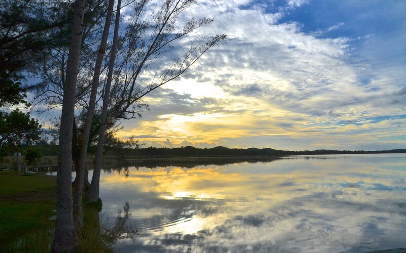 Sunset over Lake — Yellow, Serene, Photograph, Trees, Sky, Reflection