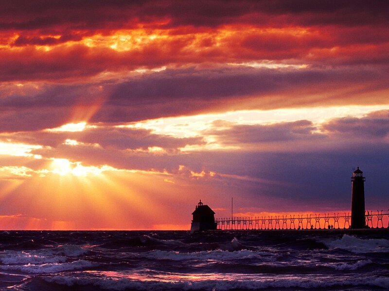 Sunset over lighthouse pier