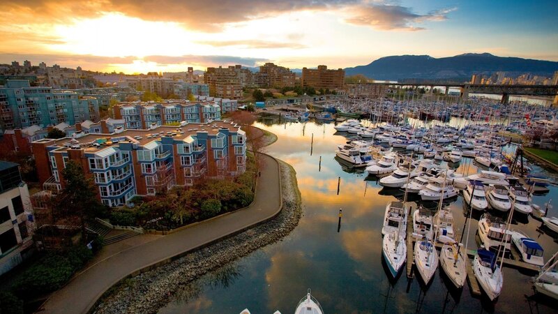 Sunset over marina and city