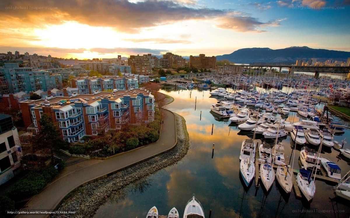 Sunset over marina and city