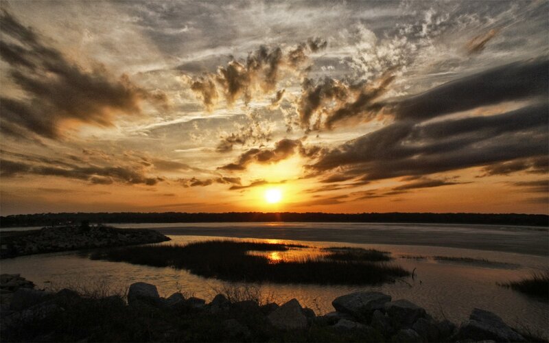 Sunset over Marshland — Orange, Dramatic, Photograph, Sun, Clouds, Water, Rocks