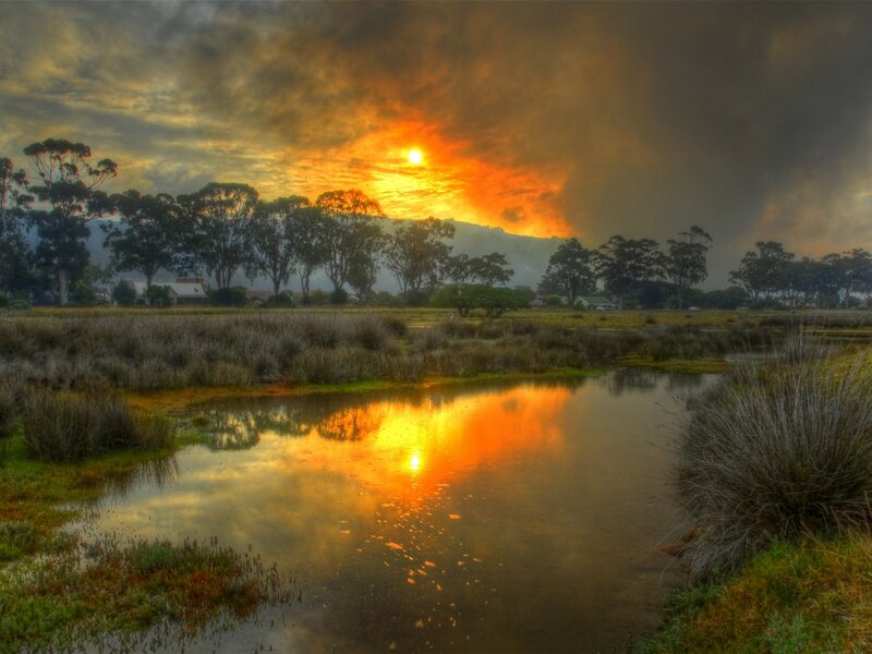 Sunset over Marshland — Orange, Dramatic, Photograph, Trees, Pond, Mountain