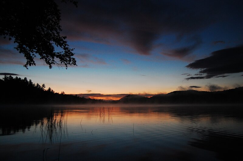 Sunset over misty lake