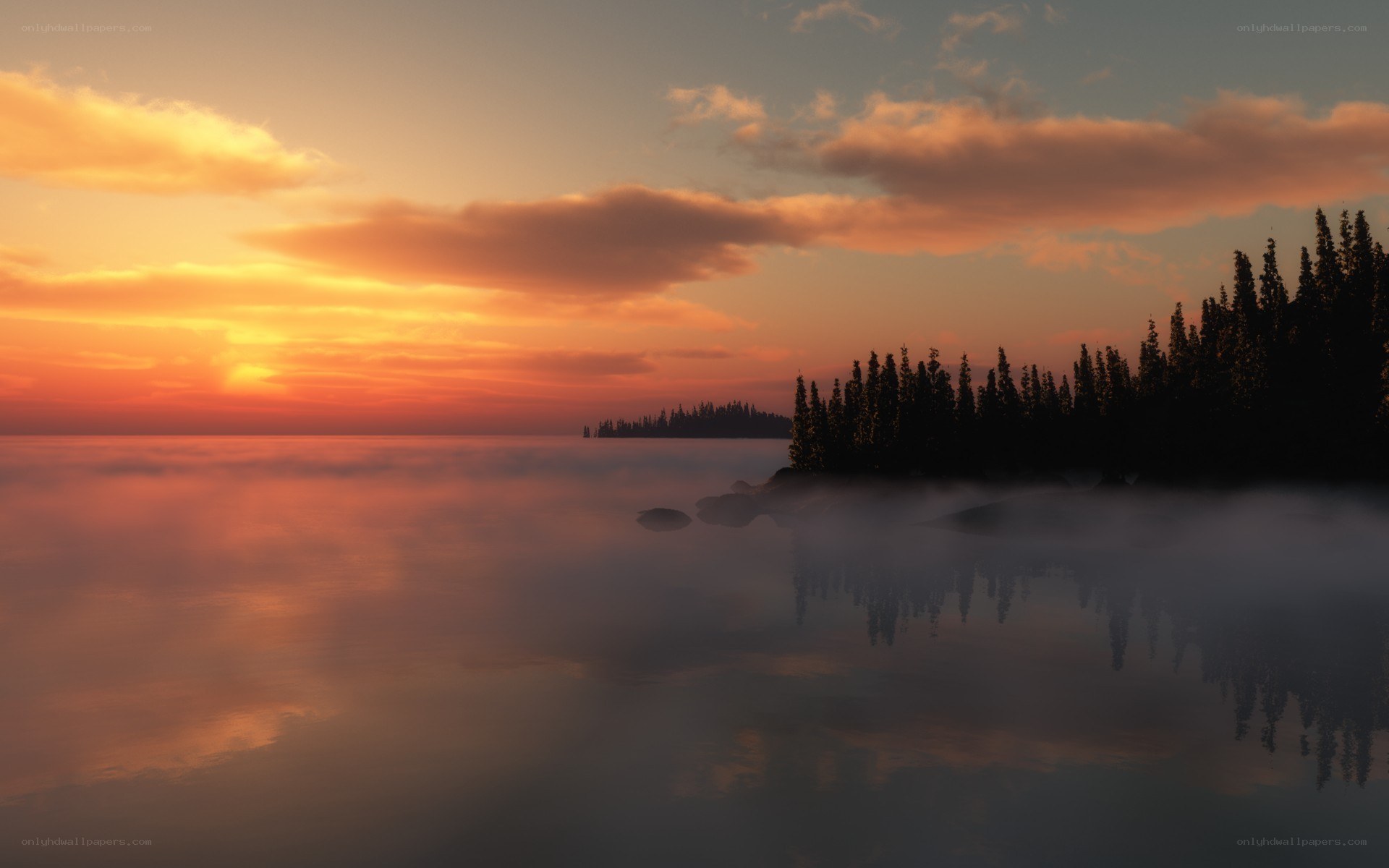 Sunset over misty lake