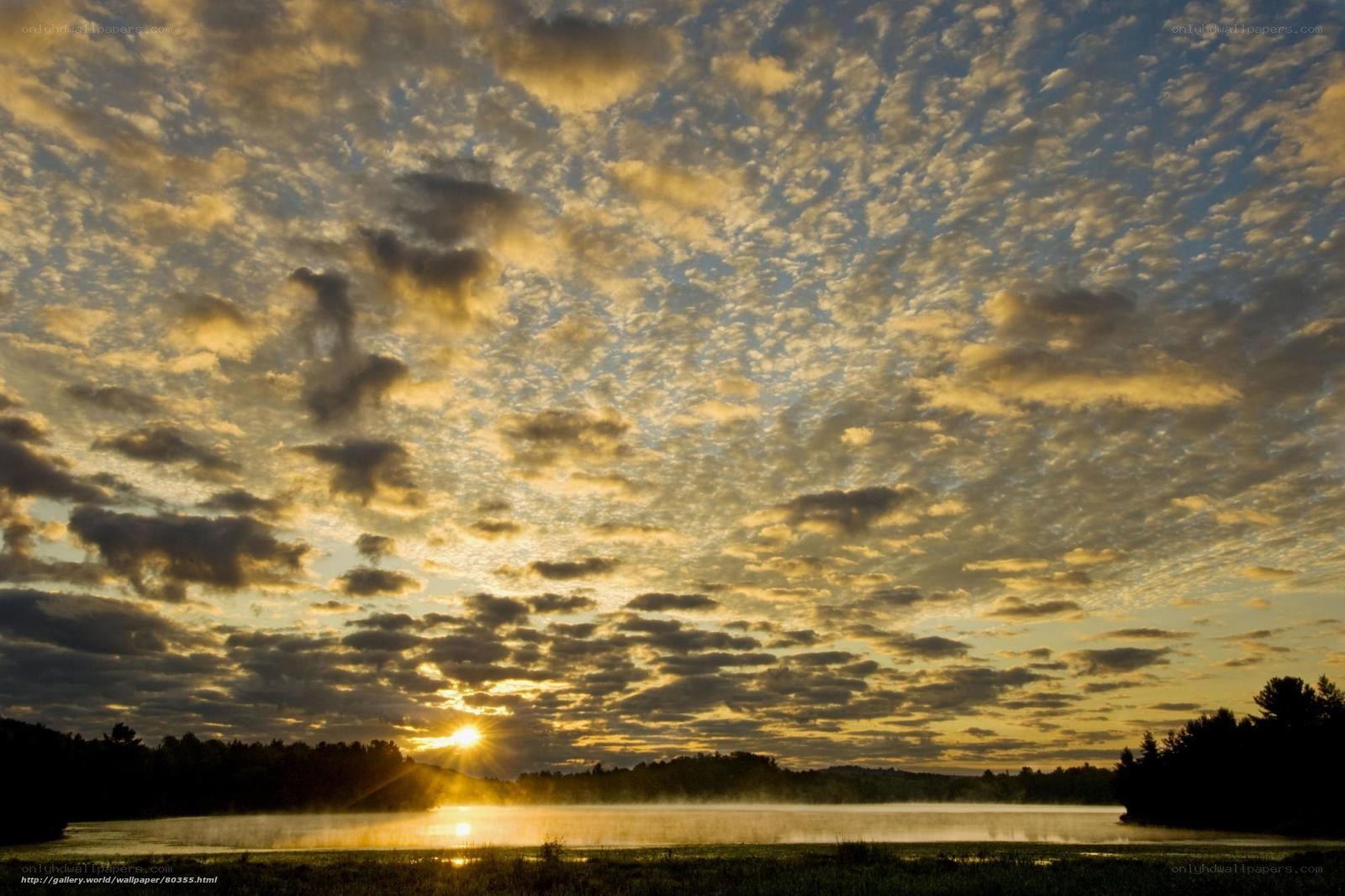Sunset over misty lake