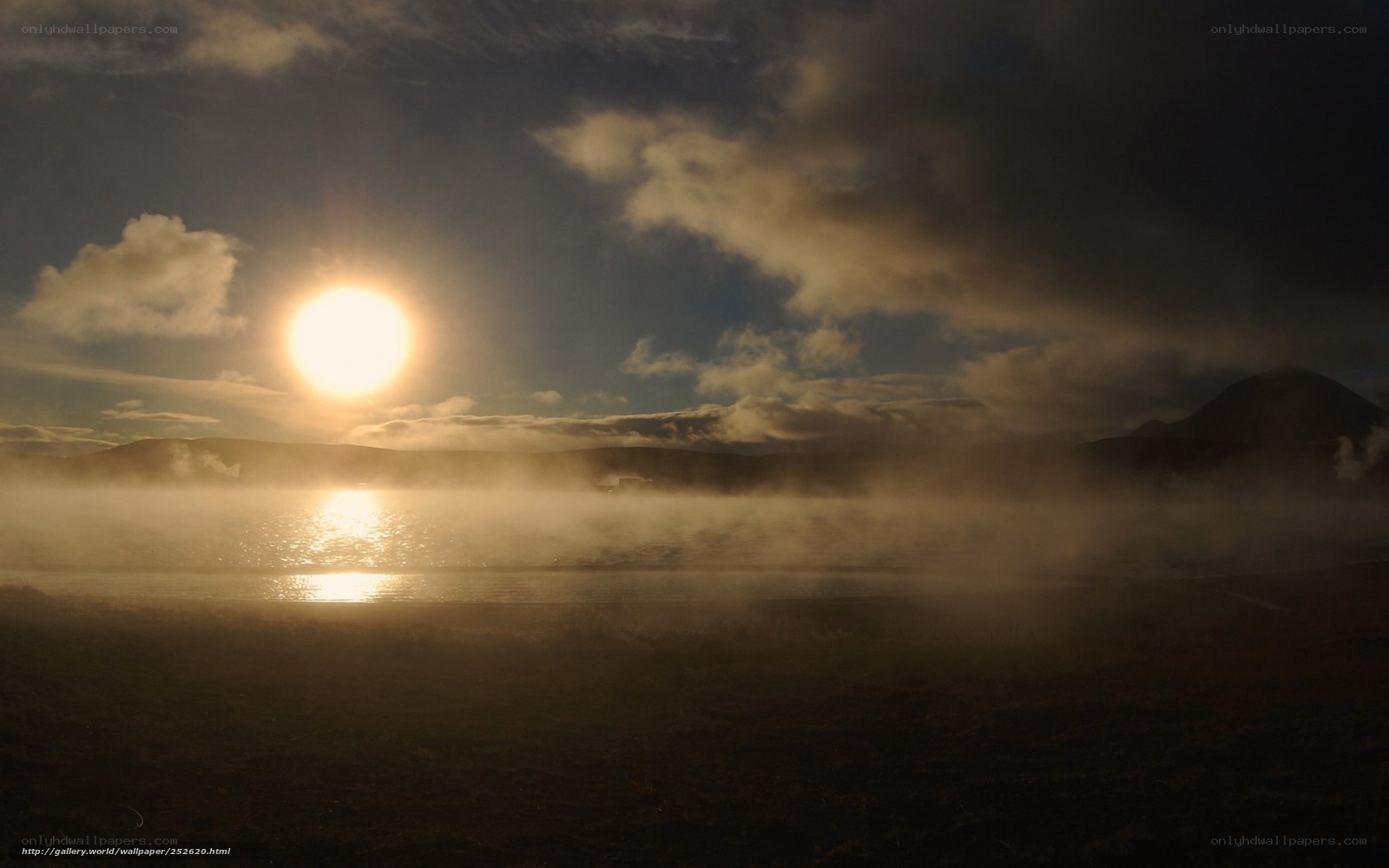 Sunset over misty lake