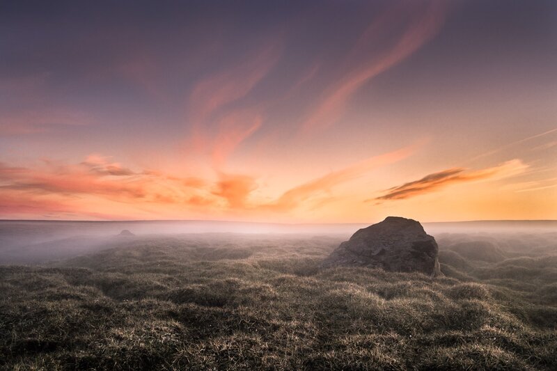 Sunset over misty moor
