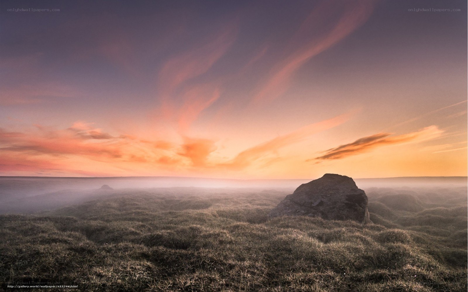 Sunset over misty moorland