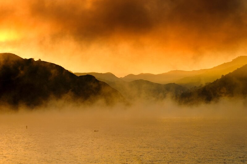 Sunset over misty mountains