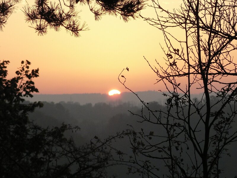 Sunset over misty valley