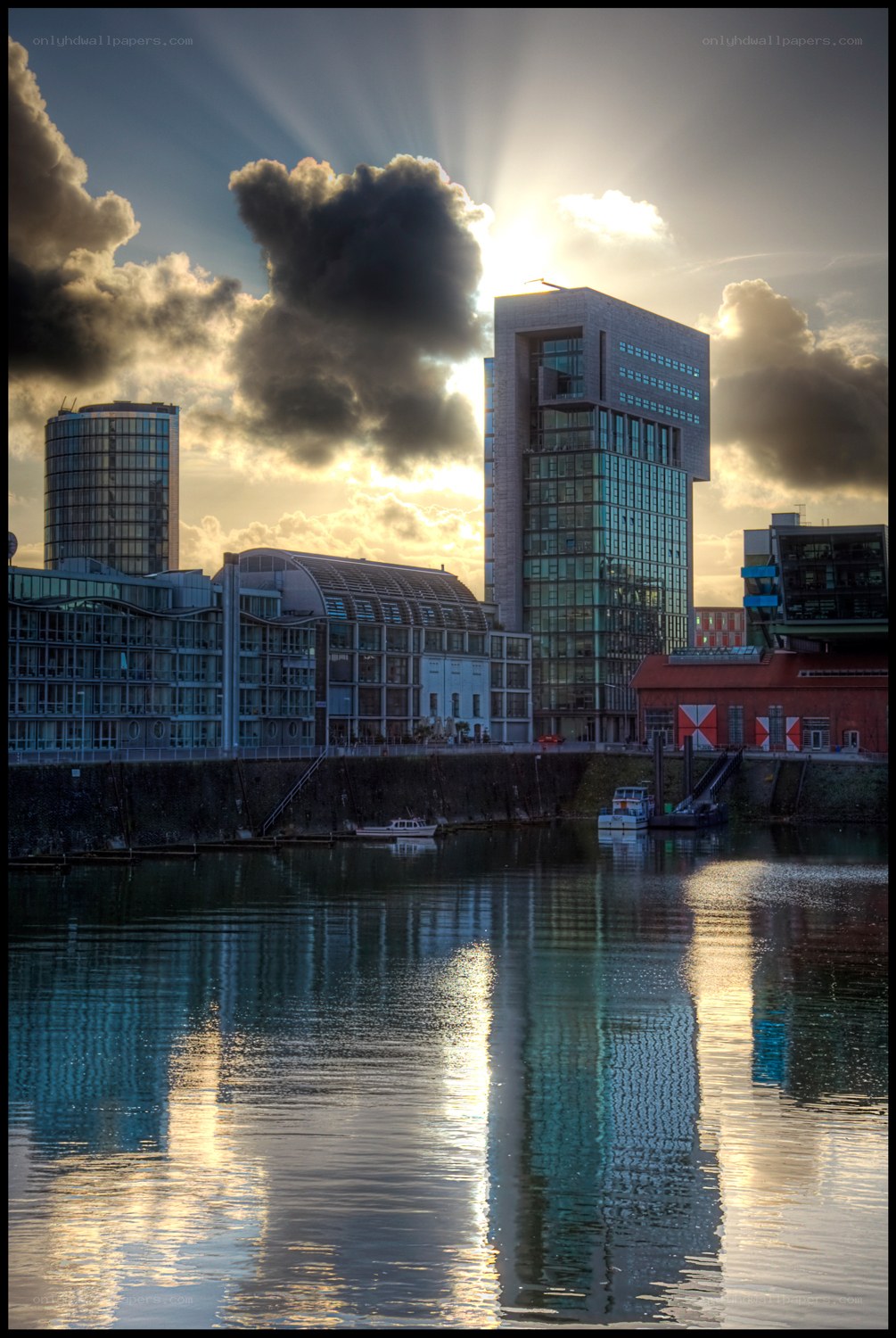 Sunset over modern city buildings