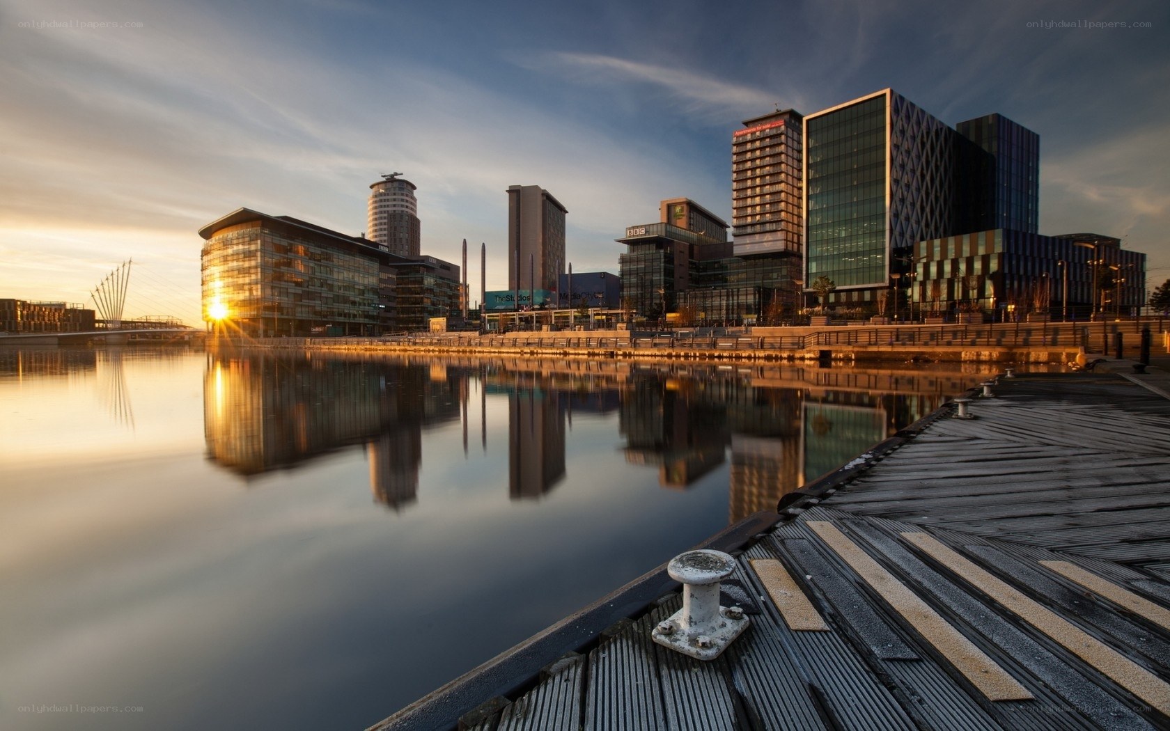 Sunset over modern city waterfront