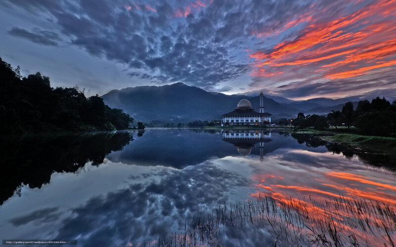 Sunset over mosque and lake
