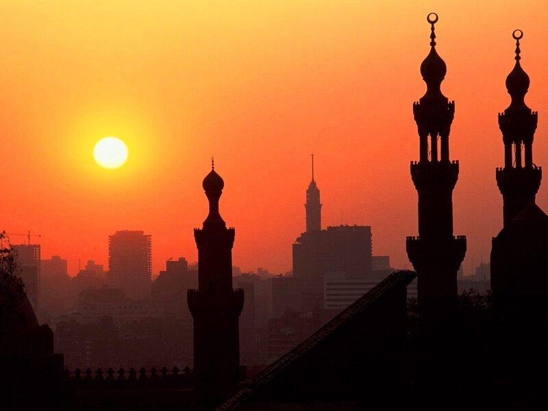Sunset over mosque minarets