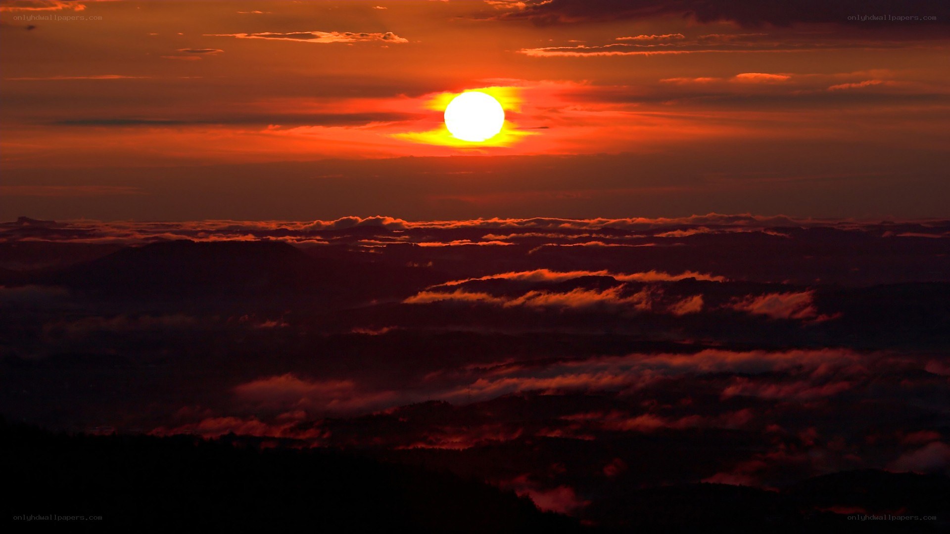 Sunset over mountain clouds